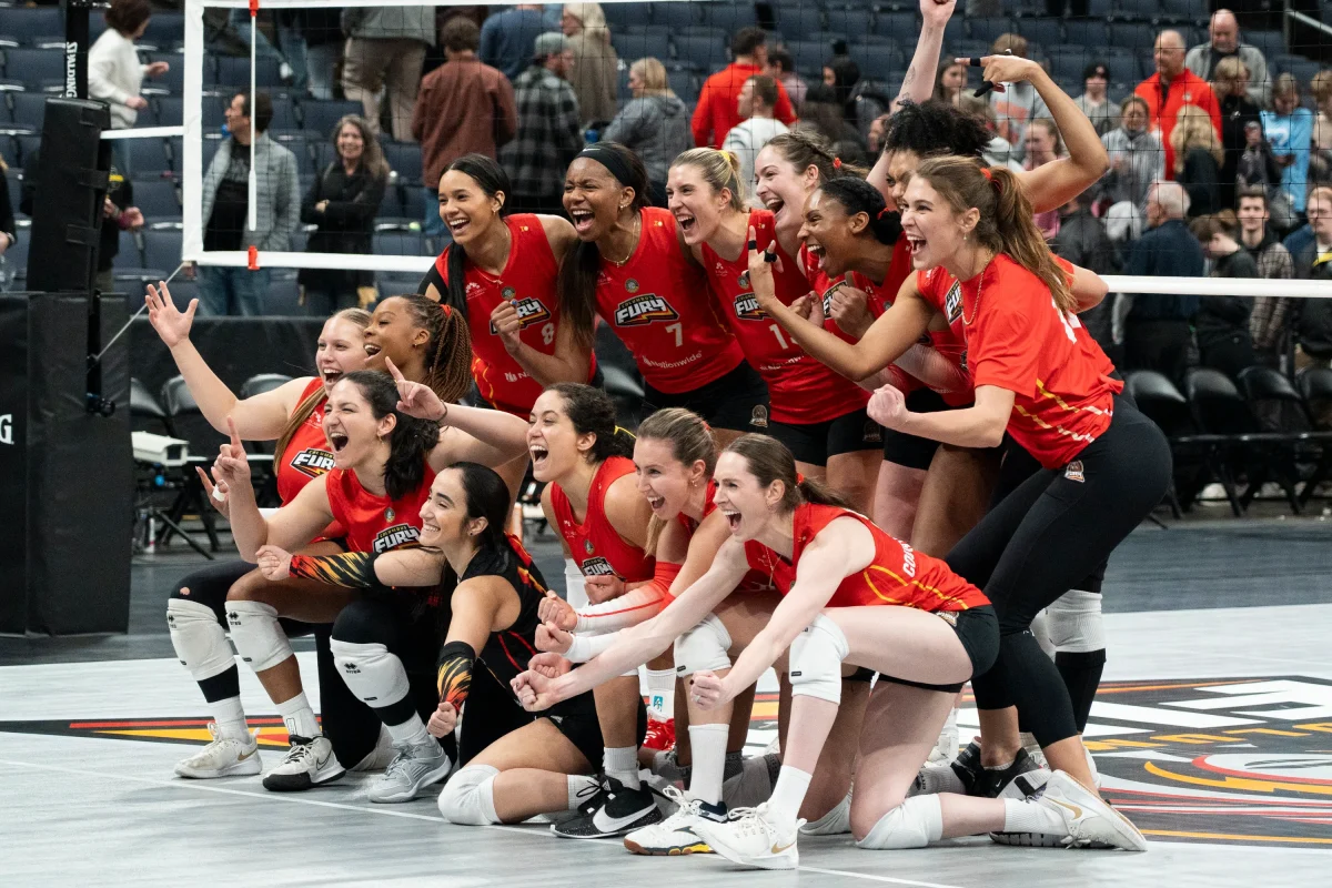 The team celebrates after winning their
first home game ever in Feb. 2024.
